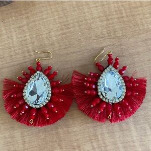 Gorgeous handmade fan earrings with a large crystal in center.